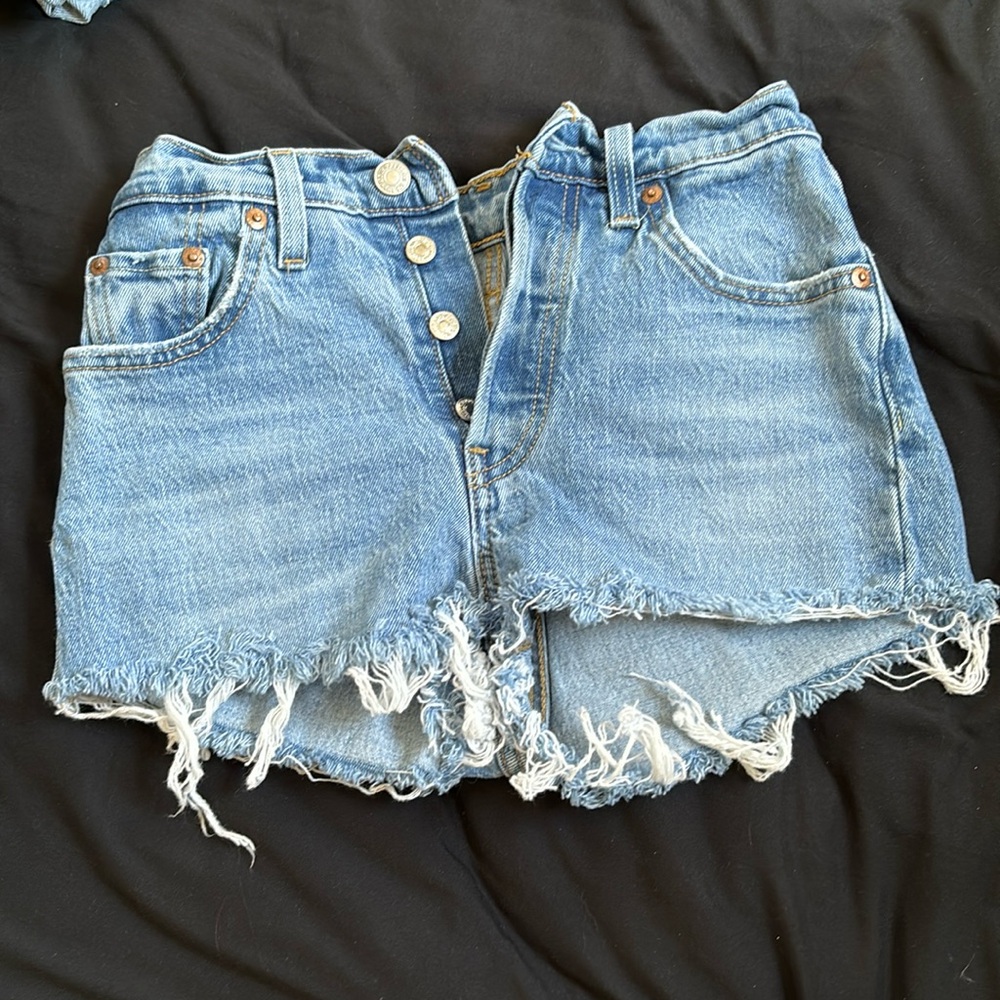 Light blue ripped Levi’s jean shorts